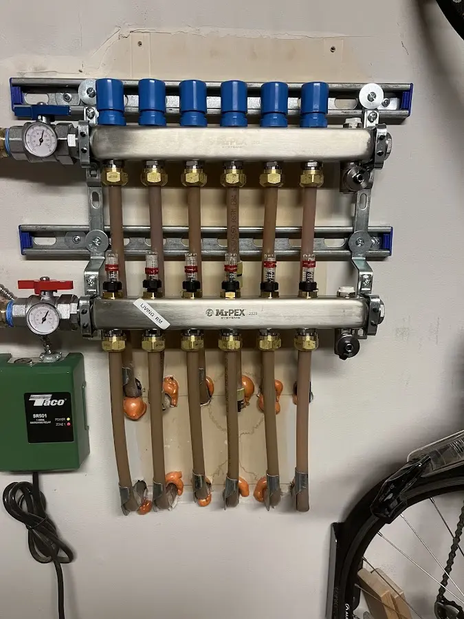 Plumber performing Water Heater Repair at a residential property in Bethel